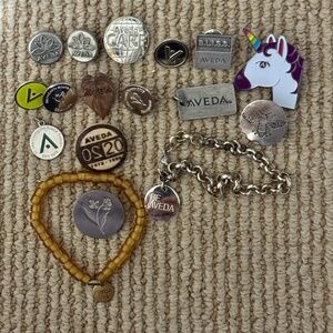 Aveda Institute Lot of 20 pieces of Jewelry Pins Charms Bracelets